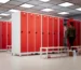 Locker room benches beside metal lockers in a changing room
