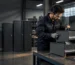 Technician checking a lateral file cabinet drawer during production for secure office document storage