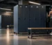 Members prepare for training in a high-traffic changing room with durable gym lockers designed for daily use